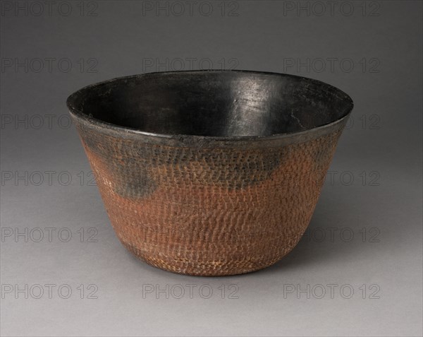 Bowl with Textured Surface Decoration, A.D. 900/1000. Conical-shaped bowl with sides angled outward, a smooth black interior, and a bumpy exterior that is black along the rim and graduates to a reddish-brown color.