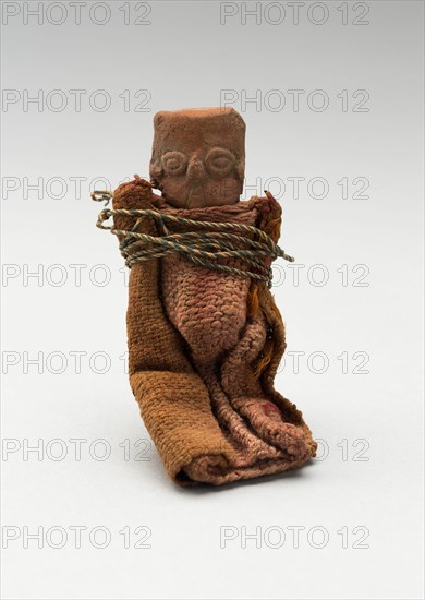 Mold-Made Female Figurine Wrapped in Cloth and Tied with String, c. A.D. 100/600.