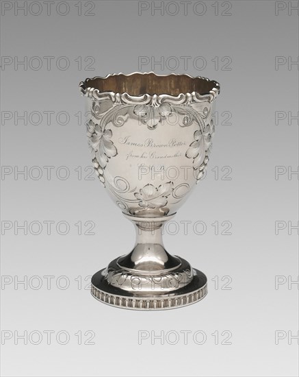 Goblet, 1852. Relief decoration of grapes and vine leaves, inscribed: 'James Brown Potter, from his Grandmother E.M.B.'.