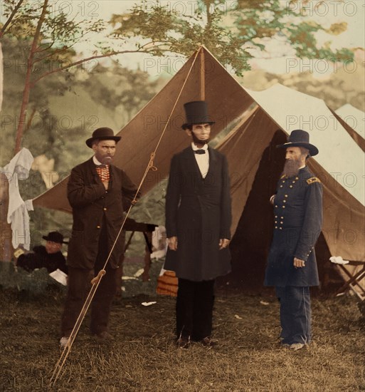 [President Abraham Lincoln, Major General John A. McClernand (right), and E. J. Allen (Allan Pinkerton, left), Chief of the Secret Service of the United States, at Secret Service Department, Headquarters Army of the Potomac, near Antietam, Maryland], October 3, 1862. (Colorised black and white print).