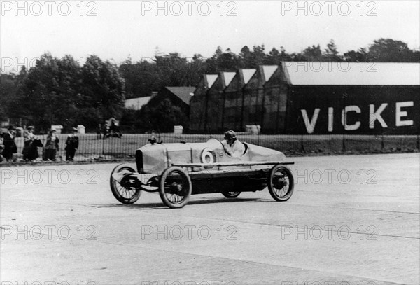 British racing driver George Bedford driving a Hillman at Brooklands, Surrey, 1921. Creator: Unknown.