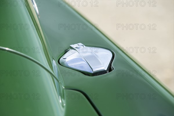 Petrol filler cap of a 1961 Aston Martin DB4 GT previously owned by Donald Campbell. Creator: Unknown.