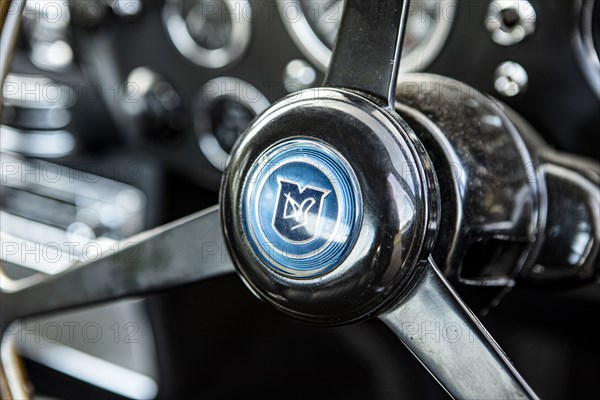 Steering wheel boss of a 1965 Aston Martin DB5. Creator: Unknown.