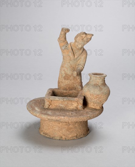 Woman Standing Over a Well, Northern Wei Dynasty (386-535), early 6th cent; with later restorations. Creator: Unknown.