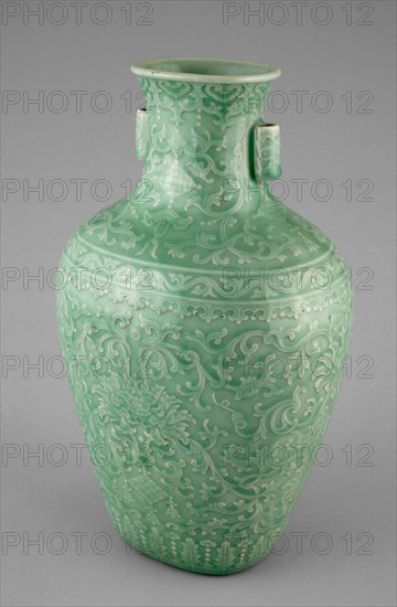Jar with Tubular Handles, Peonies, 'Endless Knot,' Pendant Balls, and Pendant Lozenges, Qing dynasty (1644-1911), Qianlong reign mark and period (1736-1795). Green glazed vessel decorated with floral adornments, tapered and flared at the neck, with two small cylindrical handles.