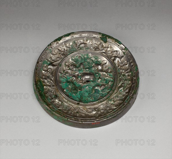 Mirror with "Lion and Grapevine" Design, Tang dynasty (A.D. 618-907), 8th century.