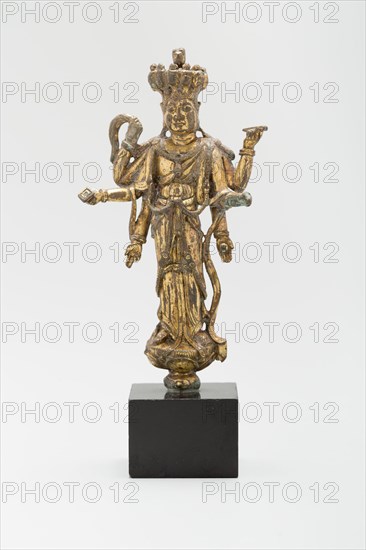 Eleven-Headed and Six-Armed Guanyin (Avalokiteshvara) Standing on a Lotus, Tang dynasty (618-907), c. 9th century.