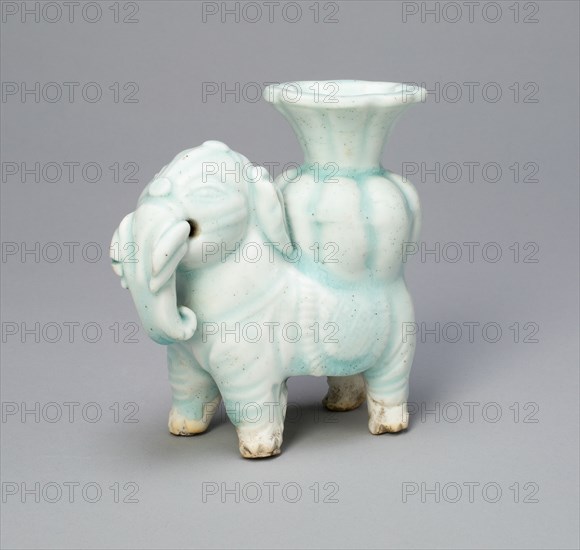 Joss-Stick Holder in the Form of an Elephant Holding a Lobed Vase, Yuan dynasty (1271-1368).