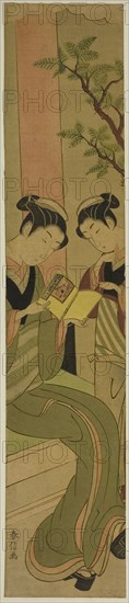 Osen of the Kagiya teahouse and an assistant reading a novelette, c. 1769/70.