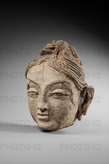 Head of a female. From Ajina Tepe, 7th-8th century. Creator: Central Asian Art.