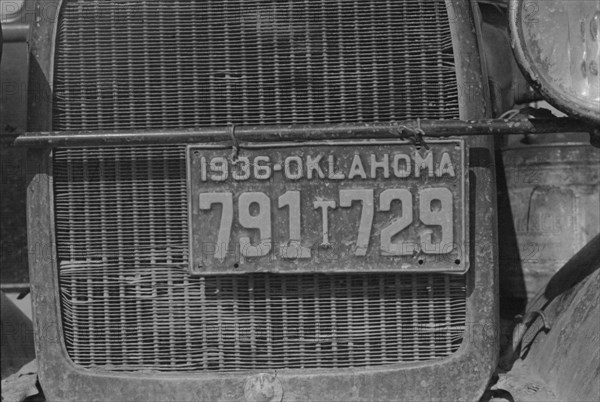 Radiator and license of Oklahoma cotton picker's car, San Joaquin Valley, California, 1936. Creator: Dorothea Lange.
