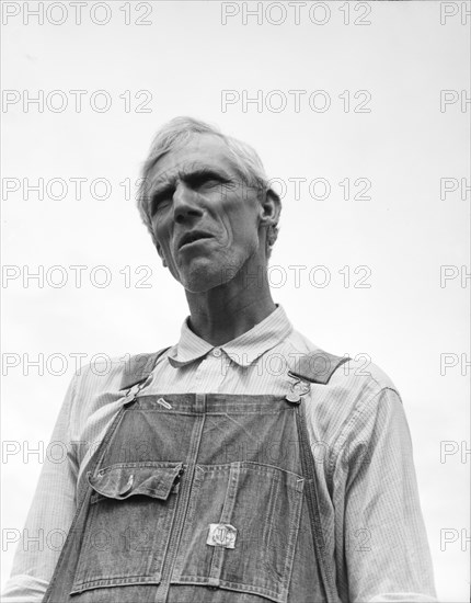 An evicted Arkansas sharecropper now settled at Hill House, Mississippi, 1936. Creator: Dorothea Lange.