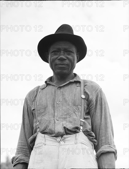 At Hill House, Mississippi - He wears the union button, 1936. Creator: Dorothea Lange.