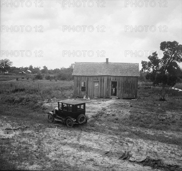 Home in a district from which many families immigrate West, near Sallisaw, Oklahoma, 1938. Creator: Dorothea Lange.