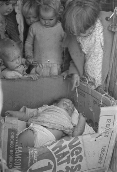 Children of migrant families in the nursery school, Kern migrant camp, California, 1936. Creator: Dorothea Lange.