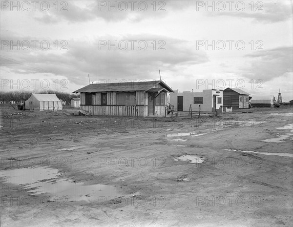 Street and homes in "Little Oklahoma", California, 1936. Creator: Dorothea Lange.