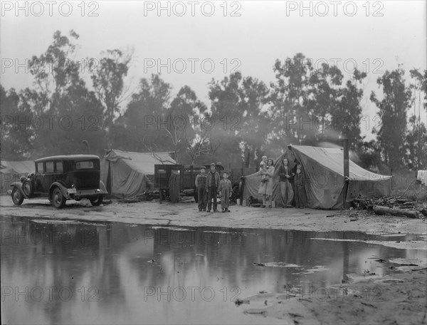 Migrant pea pickers camp in the rain, California, 1936. Creator: Dorothea Lange.