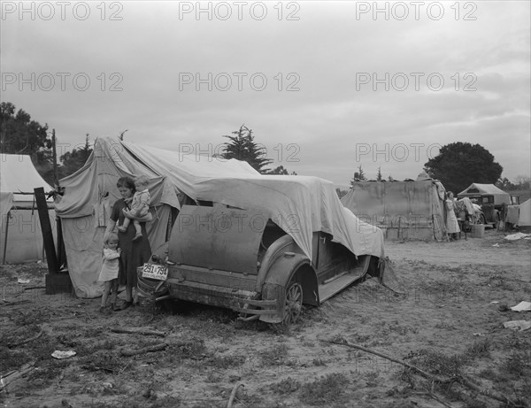 Migrant family looking for work in the pea fields, California, 1936. Creator: Dorothea Lange.