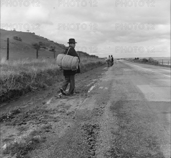 The trek of bums, tramps, single transients and undesirable indigents out of LA County, CA, 1936. Creator: Dorothea Lange.