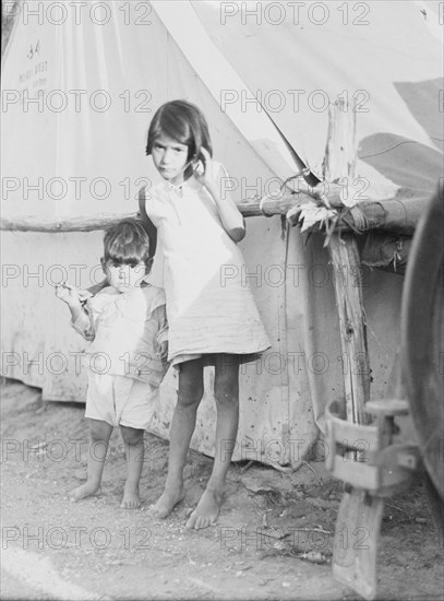 Migrant Mexican children in contractor's camp at time of early pea harvest, Nipomo, California, 1935 Creator: Dorothea Lange.