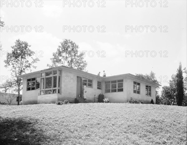 The model house nears completion, Hightstown, New Jersey, 1936. Creator: Dorothea Lange.