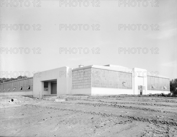 View of nearly completed factory for garment workers, Hightstown, New Jersey, 1936. Creator: Dorothea Lange.