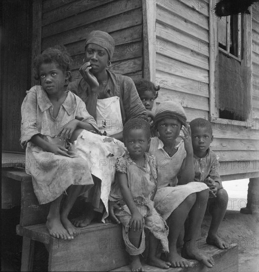 Turpentine worker's family near Cordele, Alabama, 1936. Creator: Dorothea Lange.