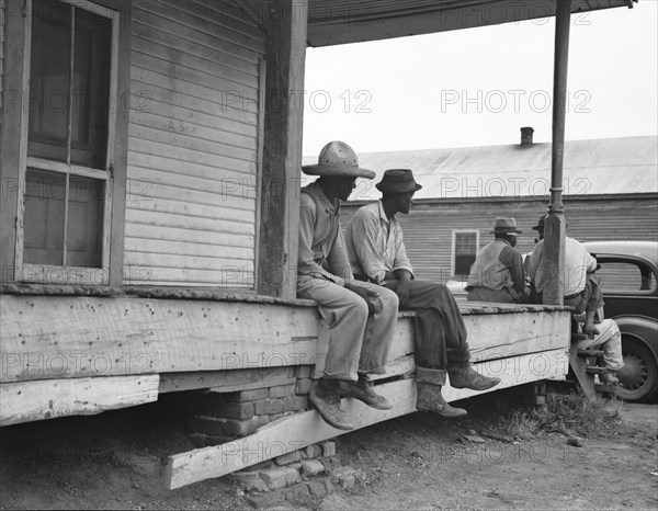 Storefront loafers, Mississippi Delta, 1936. Creator: Dorothea Lange.