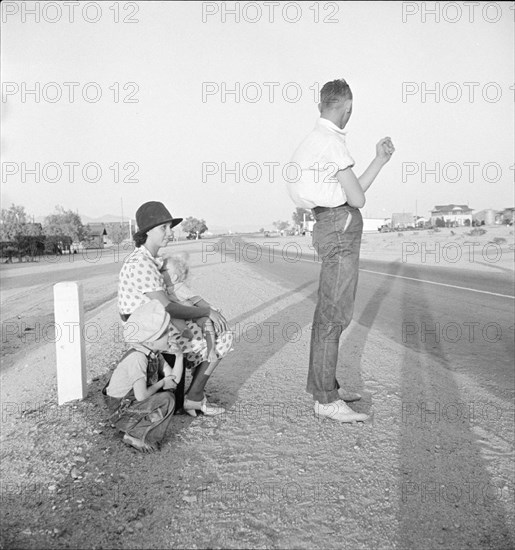 Oklahoma farm family on highway between Blythe and Indio - self-resettlement in California., 1936. Creator: Dorothea Lange.