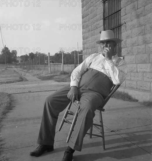 The sheriff of McAlester, Oklahoma, sitting in front of the jail, 1936. Creator: Dorothea Lange.