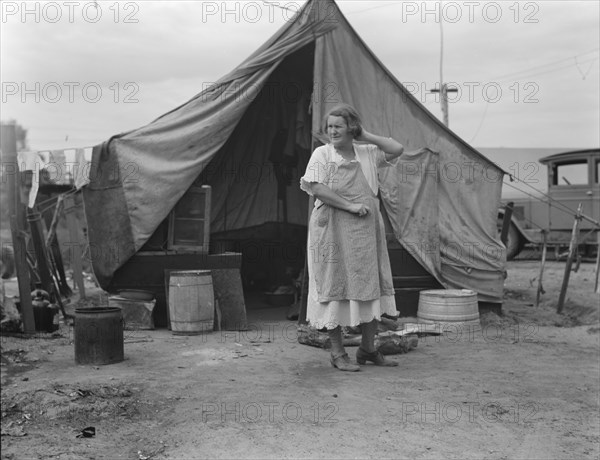 Mother of family of migrant fruit workers encamped on outskirts of Porterville, California, 1936. Creator: Dorothea Lange.