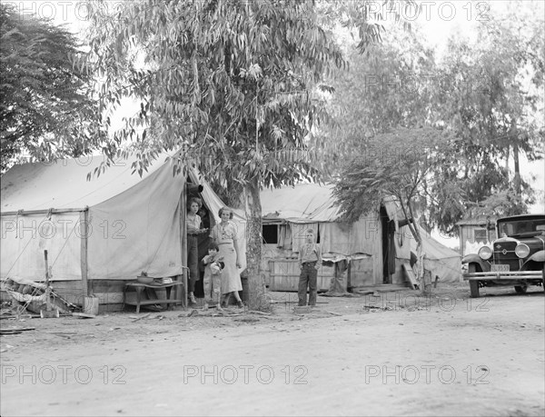 Drought refugees from Oklahoma in cotton camp near Exeter, California, 1936. Creator: Dorothea Lange.