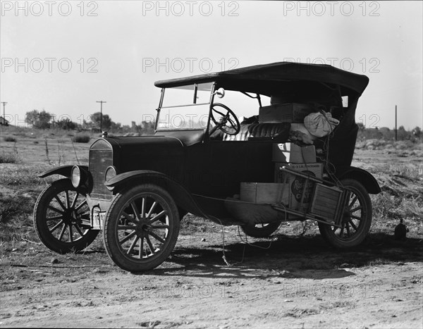 To serve the crops of California, thousands of families live on wheels, near Bakersfield, CA,1936. Creator: Dorothea Lange.