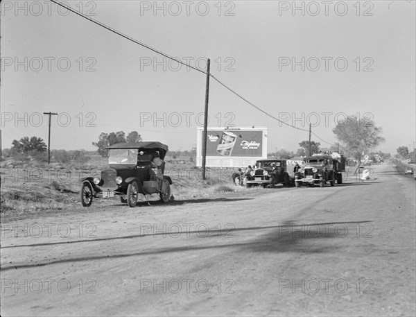 Three carloads of Mexicans headed for the Imperial Valley to harvest peas, near Bakersfield, CA,1936 Creator: Dorothea Lange.