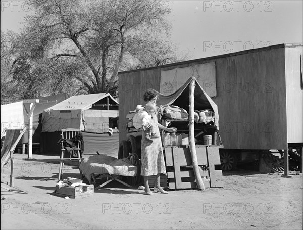 Tubercular mother from Oklahoma now living in the Kern migrant camp (resettlement), CA, 1936. Creator: Dorothea Lange.