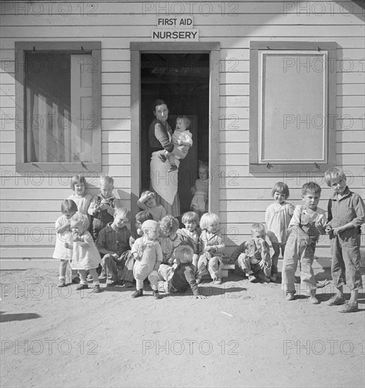 While the mothers are working in the fields, the preschool children..., Kern migrant camp, 1936. Creator: Dorothea Lange.