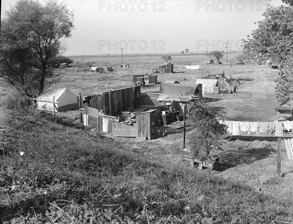 Migrant camp on the outskirts of Sacramento, California on the American River, 1936. Creator: Dorothea Lange.