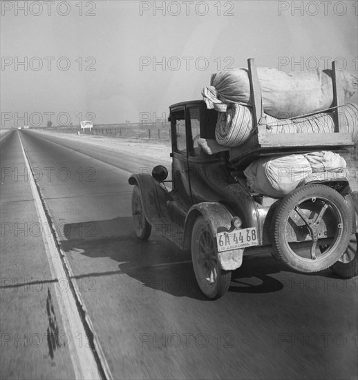 Drought refugee's car on U.S. Highway 99 between Bakersfield and Famoso, California, 1936. Creator: Dorothea Lange.