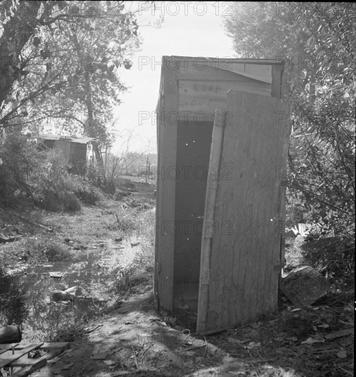 Privy in cotton camp for migratory workers, California, 1936. Creator: Dorothea Lange.