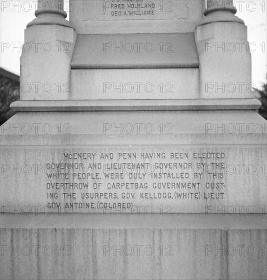 One side of the monument erected to race prejudice, New Orleans, Louisiana, 1936. Creator: Dorothea Lange.