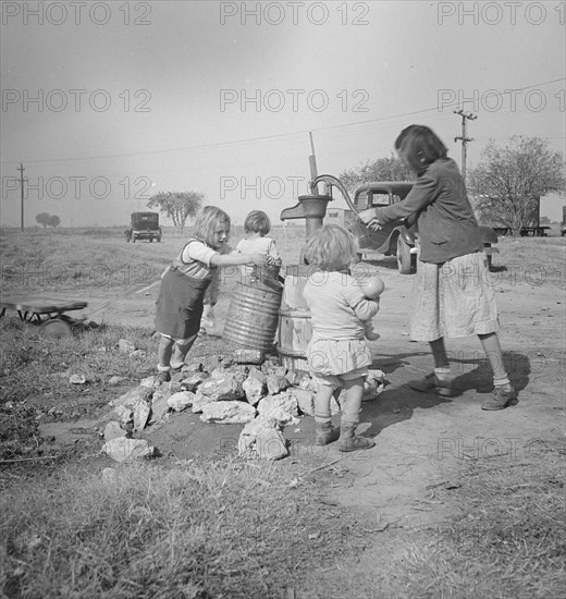 Water supply, Migratory camp for cotton pickers, San Joaquin Valley, California, 1936. Creator: Dorothea Lange.