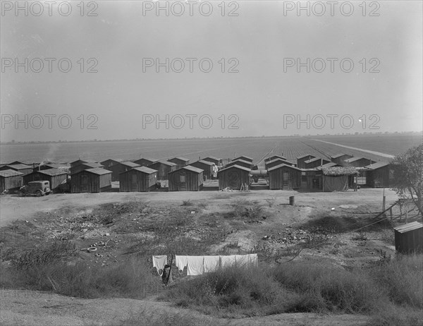 Company housing for Mexican cotton pickers, South of Corcoran, California, 1936. Creator: Dorothea Lange.