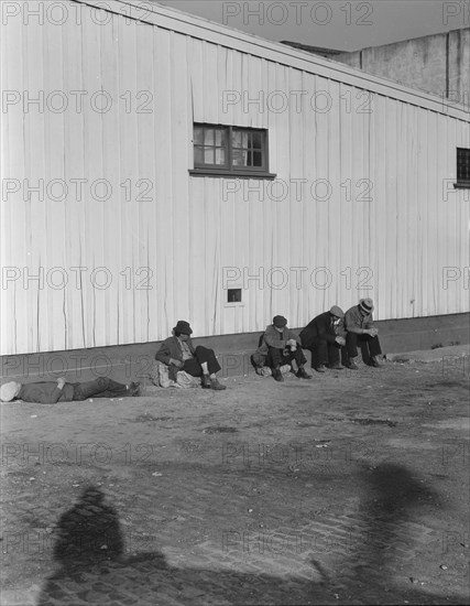 On the sun side of the shed, Transient men, San Francisco, California, 1936. Creator: Dorothea Lange.