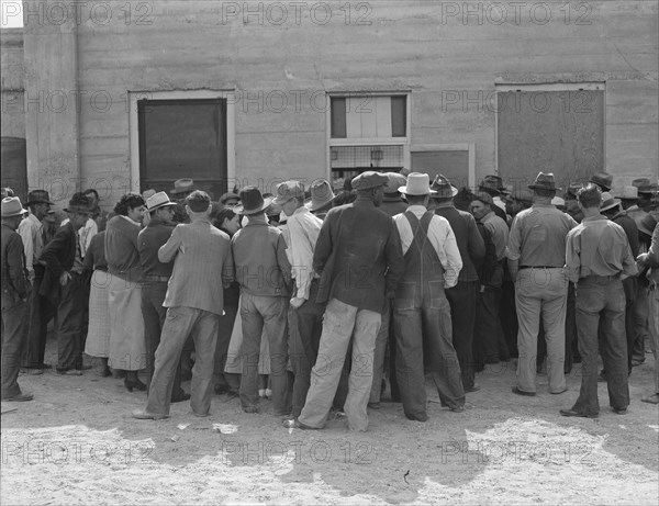 Waiting for relief checks, Calipatria, California, 1937. Creator: Dorothea Lange.