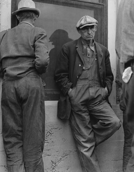 Waiting for the semimonthly relief checks at Calipatria, Imperial Valley, California, 1937. Creator: Dorothea Lange.