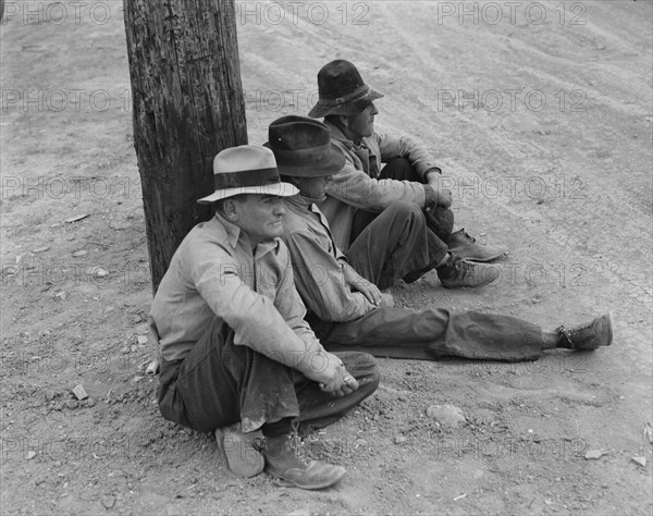 Waiting for the semi-monthly relief checks at Calipatria, California, 1937. Creator: Dorothea Lange.