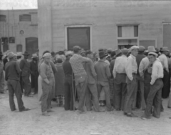 Waiting for the semi-monthly relief checks at Calipatria, California, 1937. Creator: Dorothea Lange.