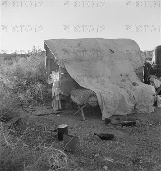 Oklahomans encamped on a river bottom near Holtville, California, 1937. Creator: Dorothea Lange.