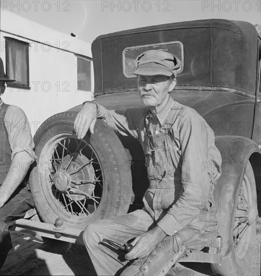 Oklahoman from Chickasaw in potato pickers' camp, Kern County, California, 1937. Creator: Dorothea Lange.