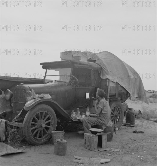 Potato picker in camp near Shafter, California, 1937. Creator: Dorothea Lange.